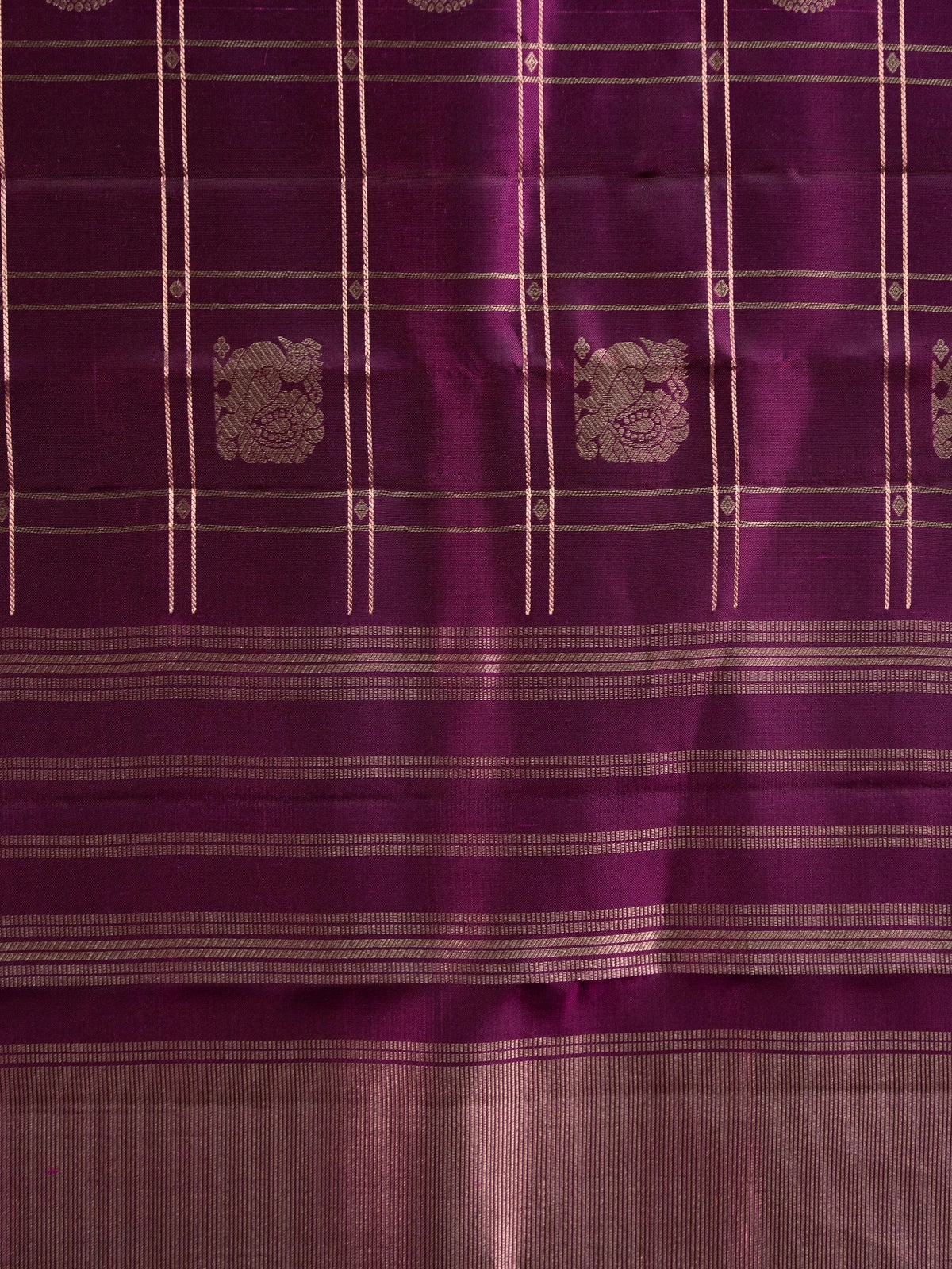 Wine purple pure Kanchipuram silk saree with gold zari checks, woven buttas and contrast zari border