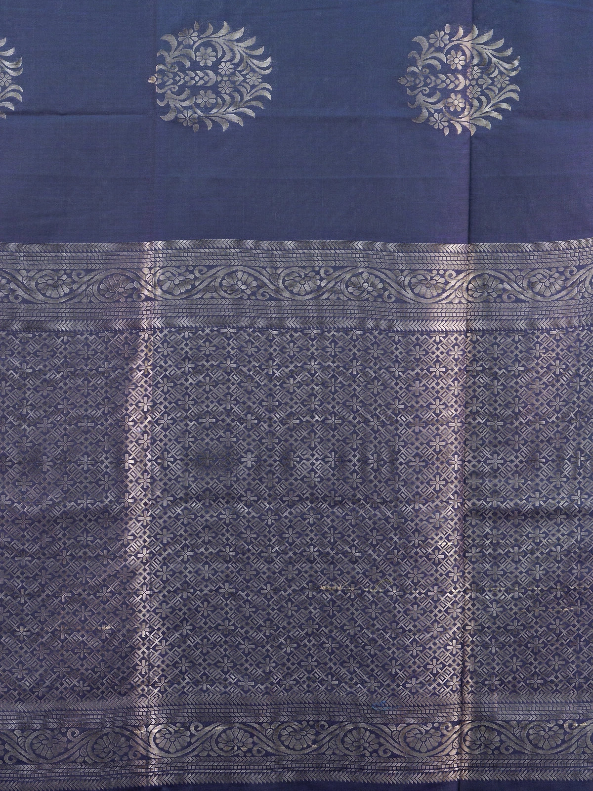 Navy blue Kanchipuram fancy silk saree with peacock blue contrast border and silver zari floral buttas
