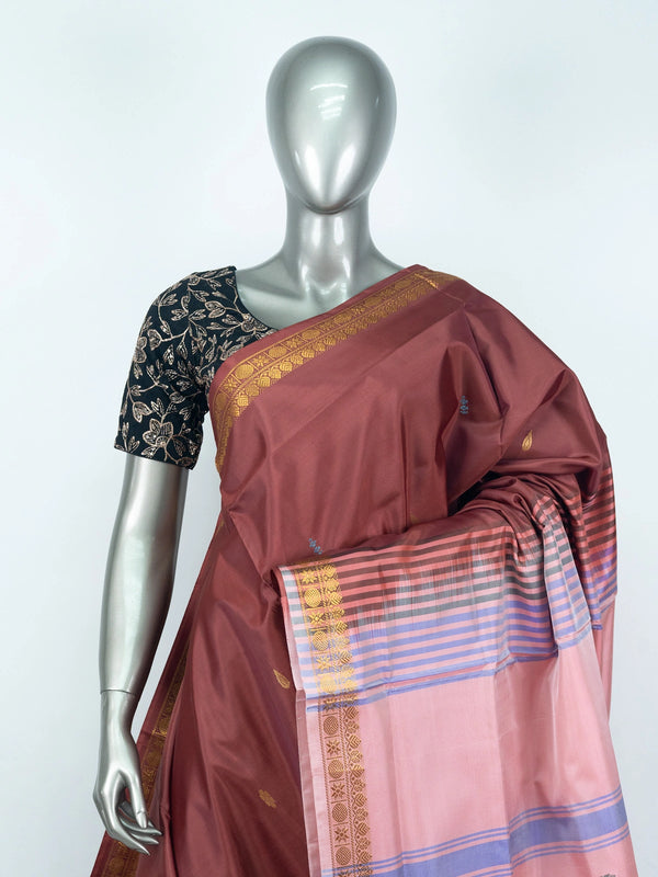 Maroon banana silk saree with contrast pink striped pallu and gold zari border