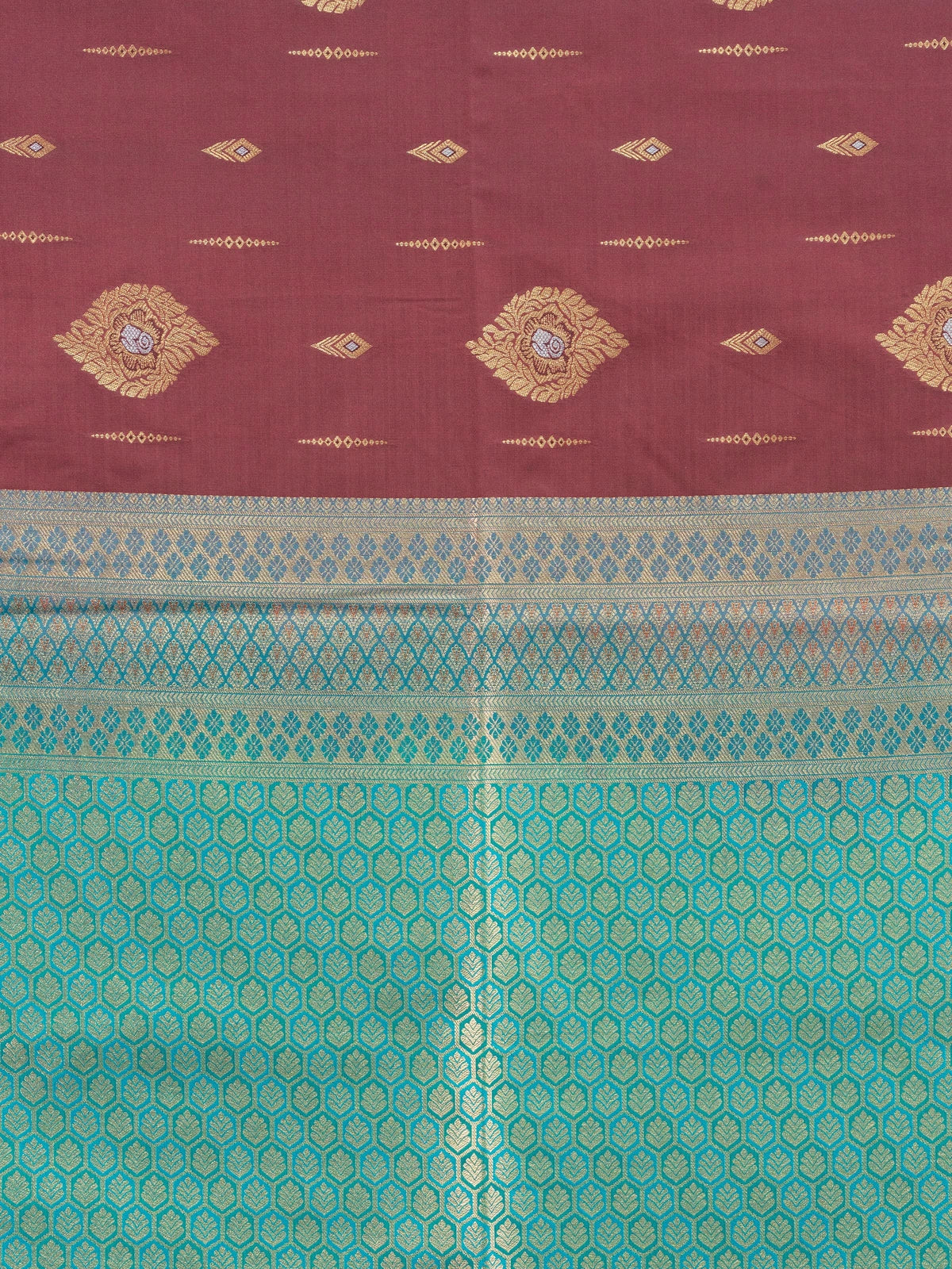 Maroon semi silk saree with gold zari buttas and a contrast teal zari border and pallu