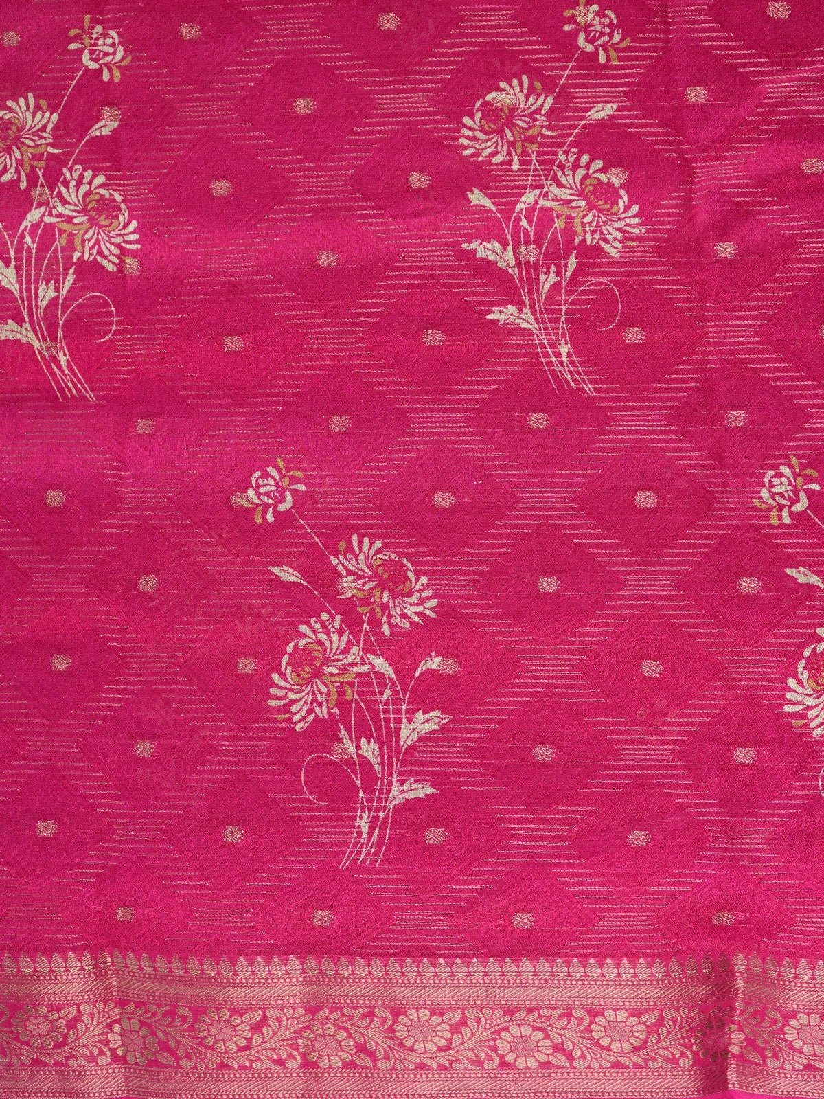 Rani pink designer saree with floral motifs, gold zari butti and woven zari border