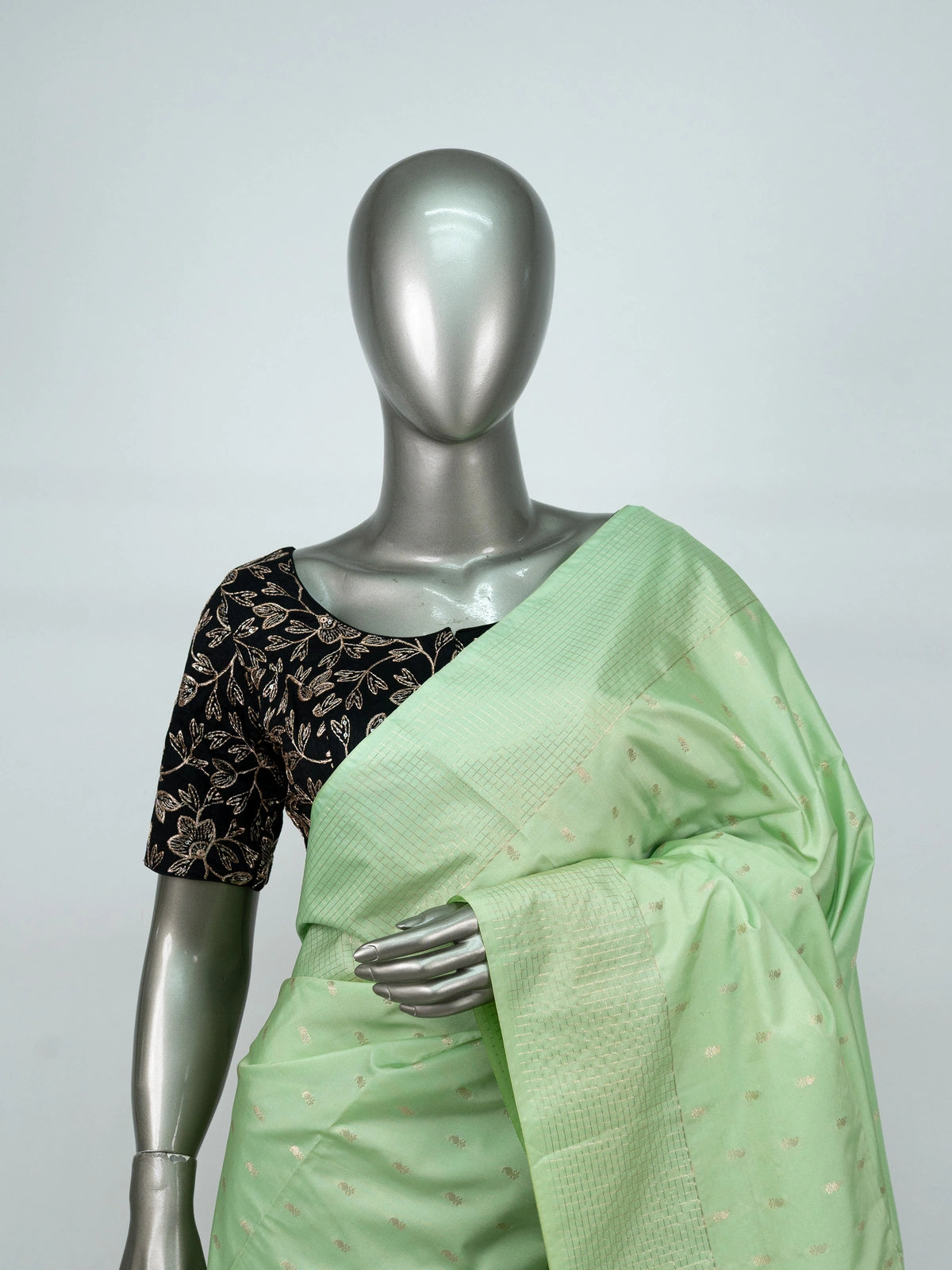 Pastel green Vaira Oosi Design semi silk saree with gold zari butis and contrast dark green zari border