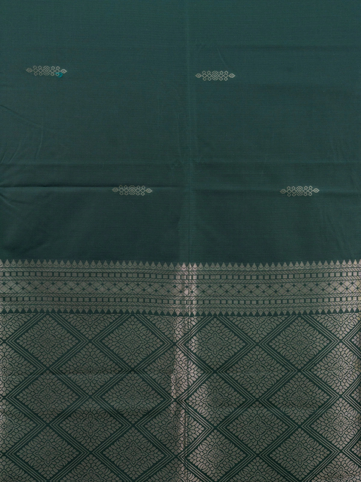 Bottle green semi silk saree with copper contrast border and gold zari pallu