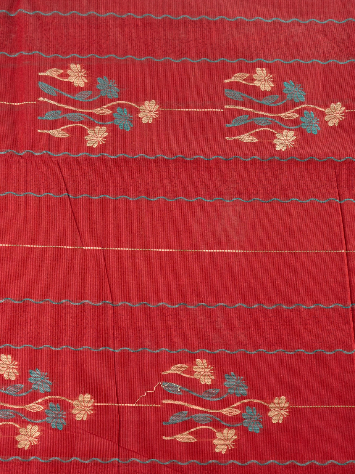 Maroon red silk cotton saree with orange contrast border, floral woven motifs and decorative pallu