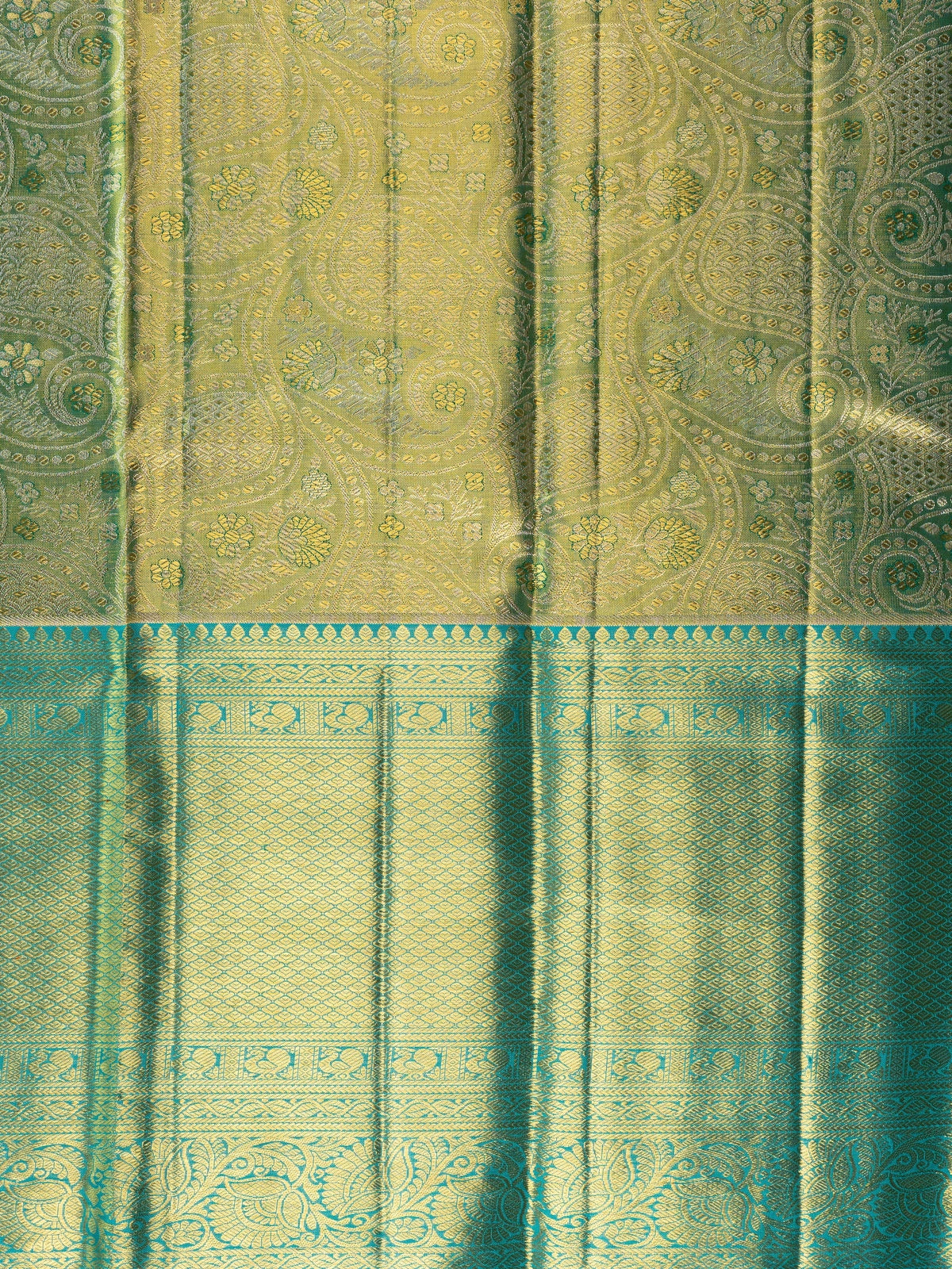 Green pure Kanchipuram silk saree with gold zari brocade body and contrast teal blue zari border