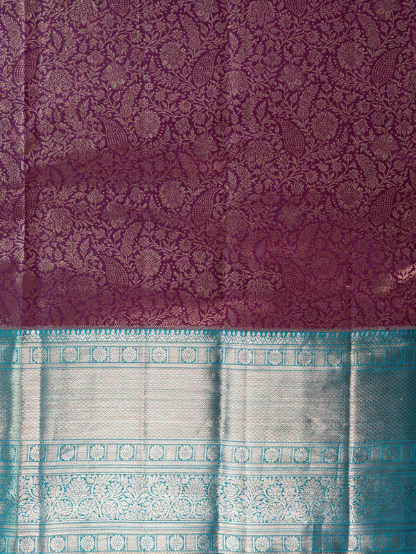 Purple pure Kanchipuram silk saree with silver zari floral weaving and contrast teal blue border and pallu