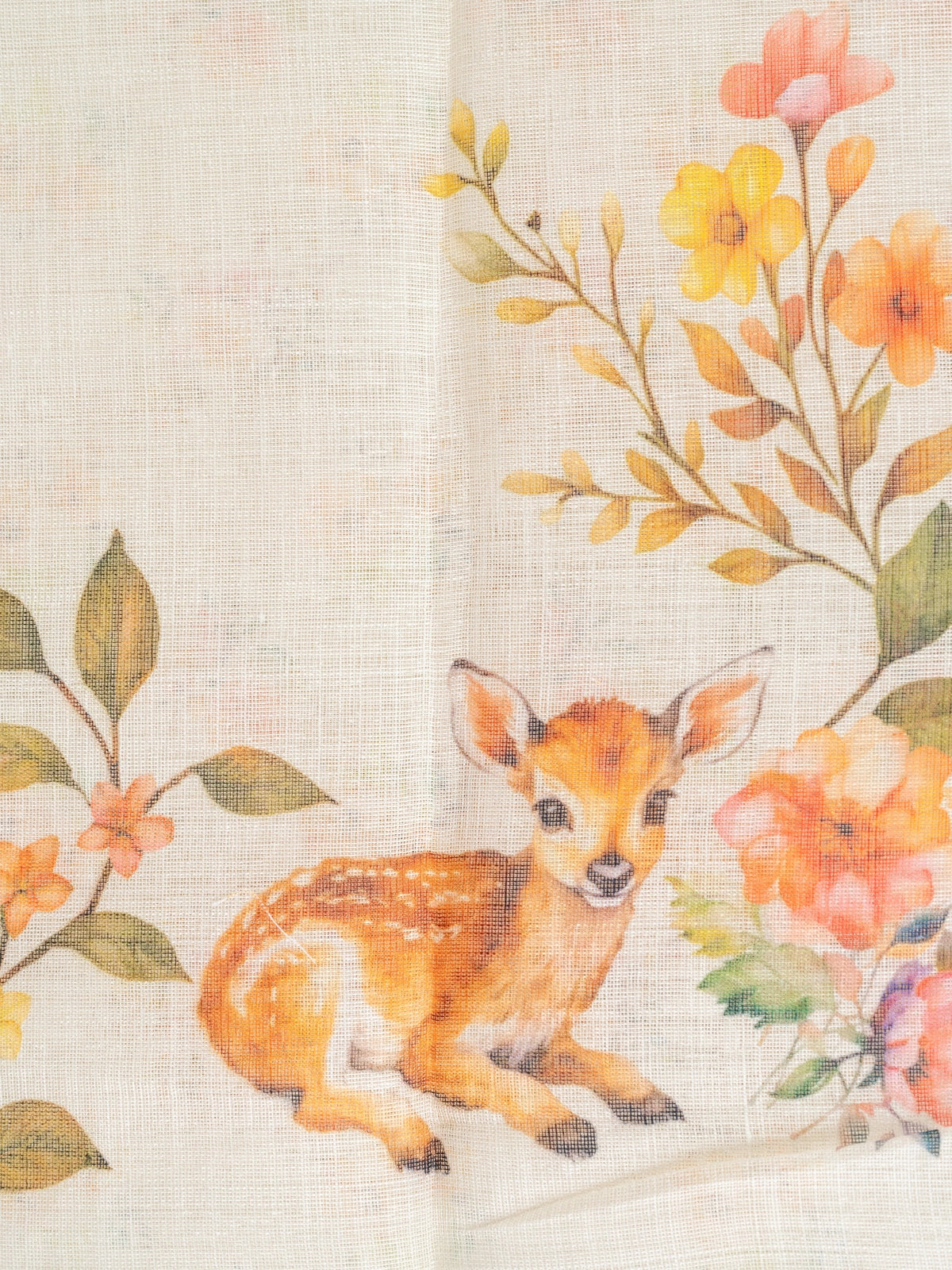 Cream linen cotton saree with orange floral and spotted deer prints and a slim golden zari border