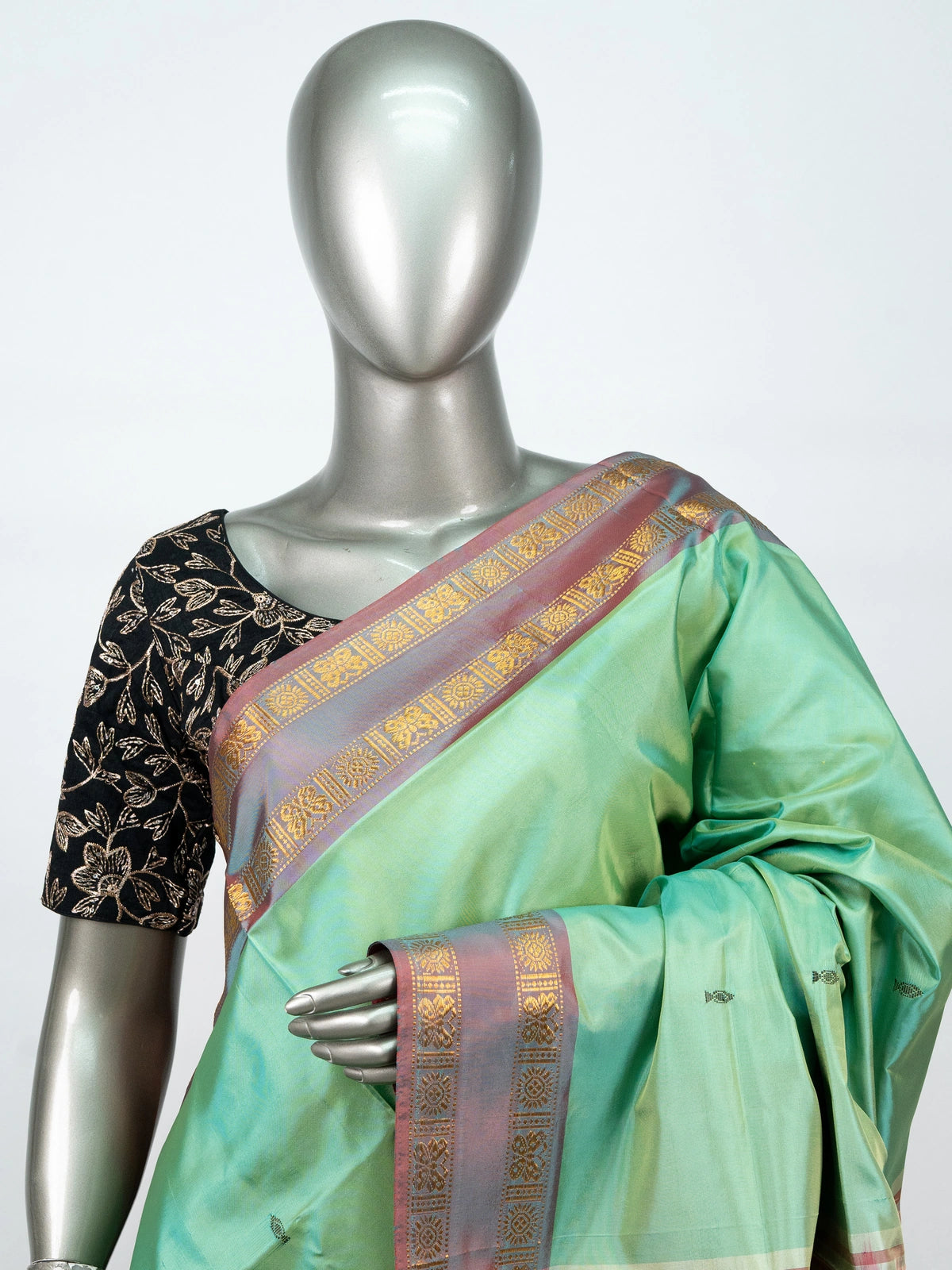 Sea green banana silk saree with contrast red pallu and gold zari border