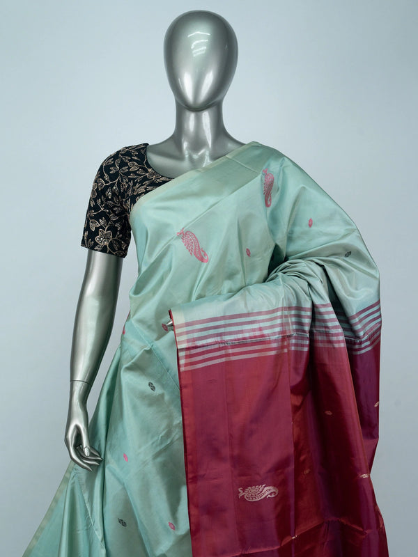 Sea green Banana Silk saree with contrast maroon pallu, paisley butta and silver zari motifs