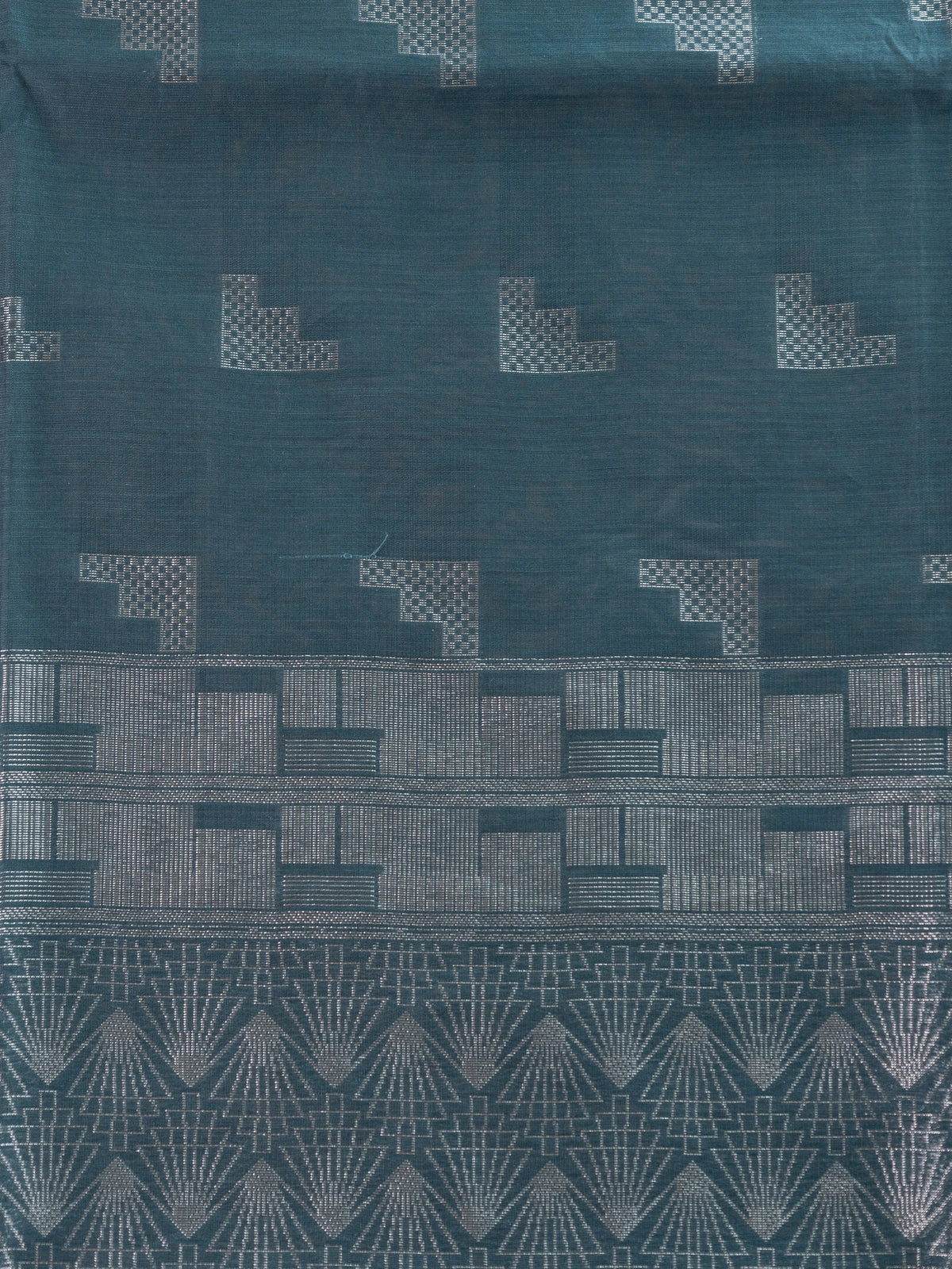 Teal blue silk cotton saree with silver zari geometric motifs and patterned pallu