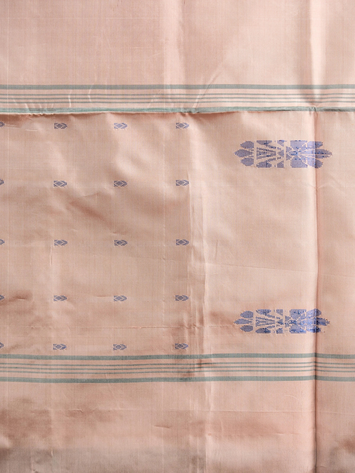 Dark green banana silk saree with gold zari stripes and contrast peach pallu with blue floral motifs