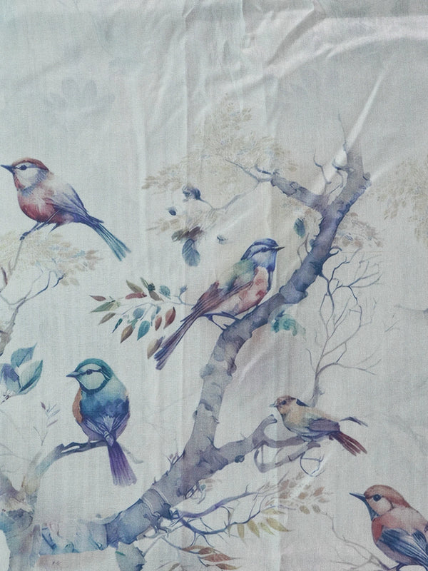 Teal blue and cream semi tussar saree with watercolour bird print and gold zari border