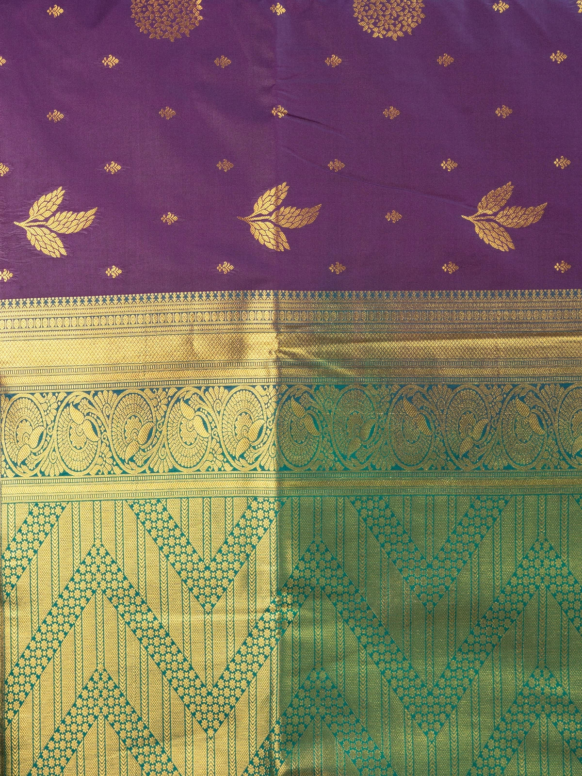 Purple semi silk saree with gold zari butta, contrast green zari border and ornate green-gold pallu