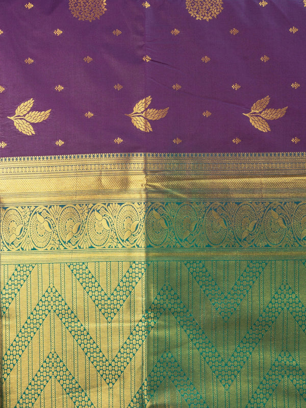Purple semi silk saree with gold zari butta, contrast green zari border and ornate green-gold pallu