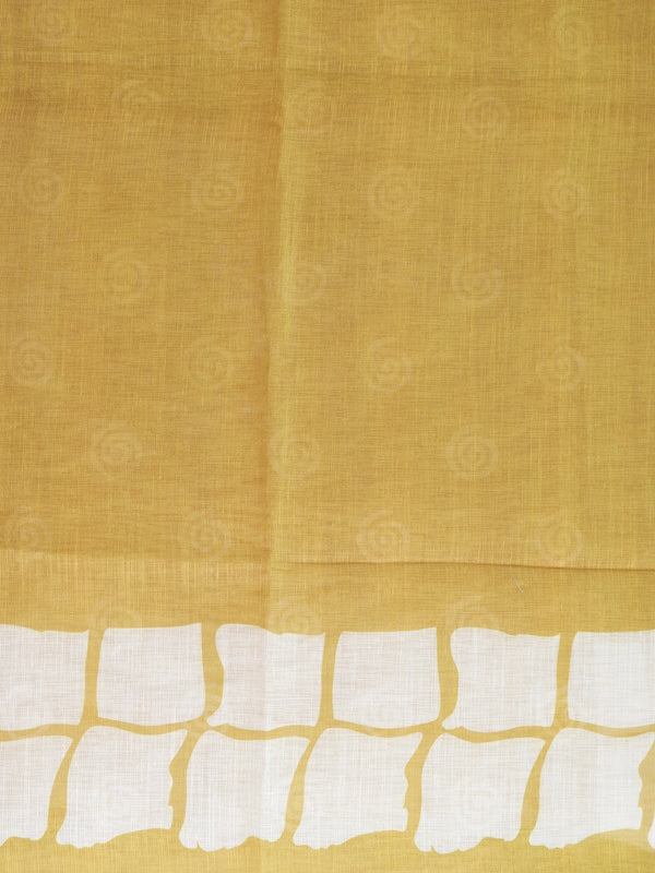Mustard and white batik print linen cotton saree with contrast tile border and spiral motifs