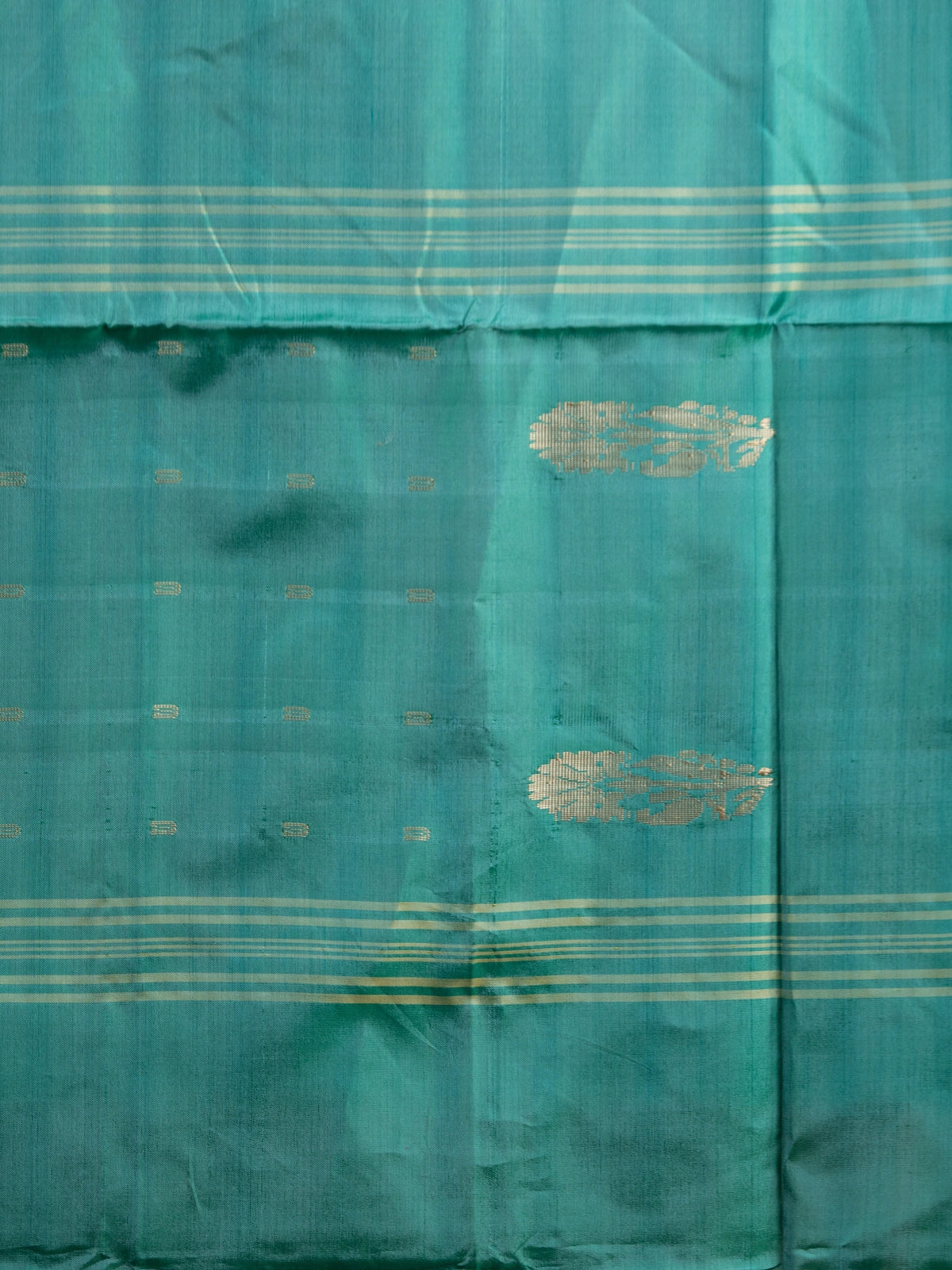 Peach pink and teal green banana silk saree with gold zari buttas and contrast striped pallu