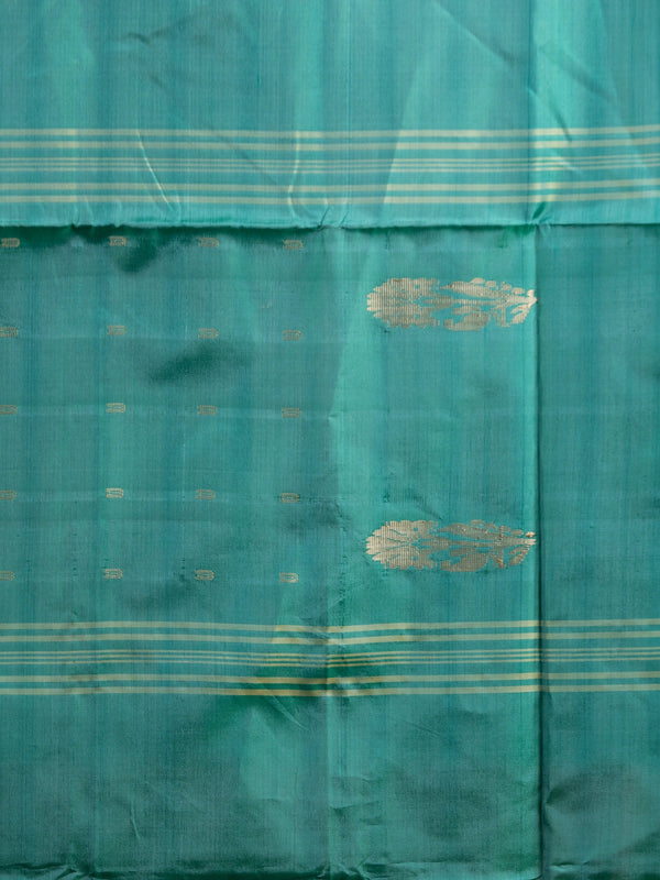 Peach pink and teal green banana silk saree with gold zari buttas and contrast striped pallu