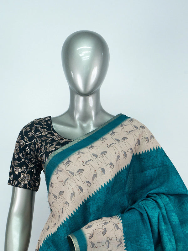 Teal linen cotton saree with cream crane-motif contrast border and temple-style edging