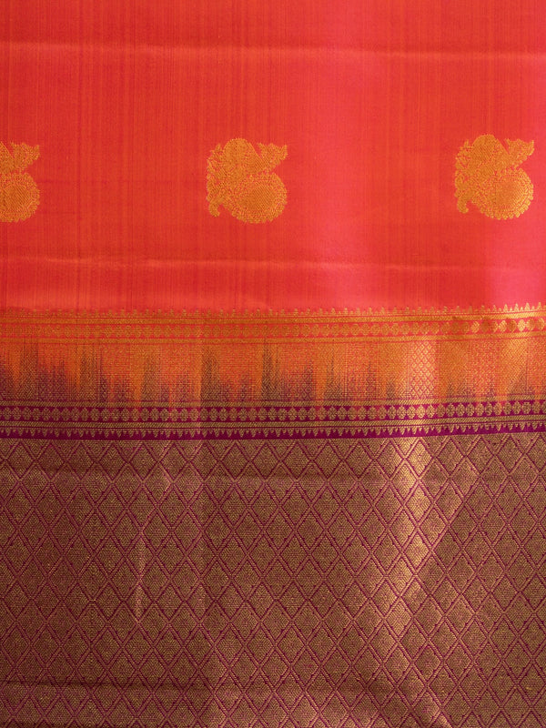 Orange-red pure Kanchipuram silk saree with gold zari buttas and contrast purple zari border and pallu