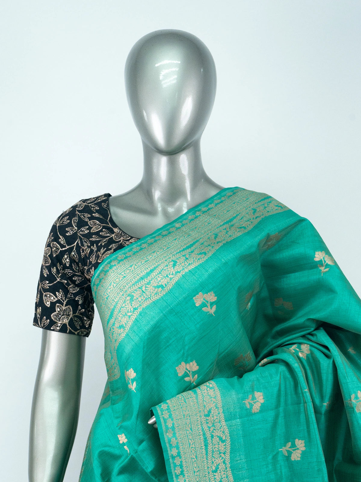 Sea green semi raw silk saree with gold zari floral buttas, contrast zari border and multicolour floral pallu