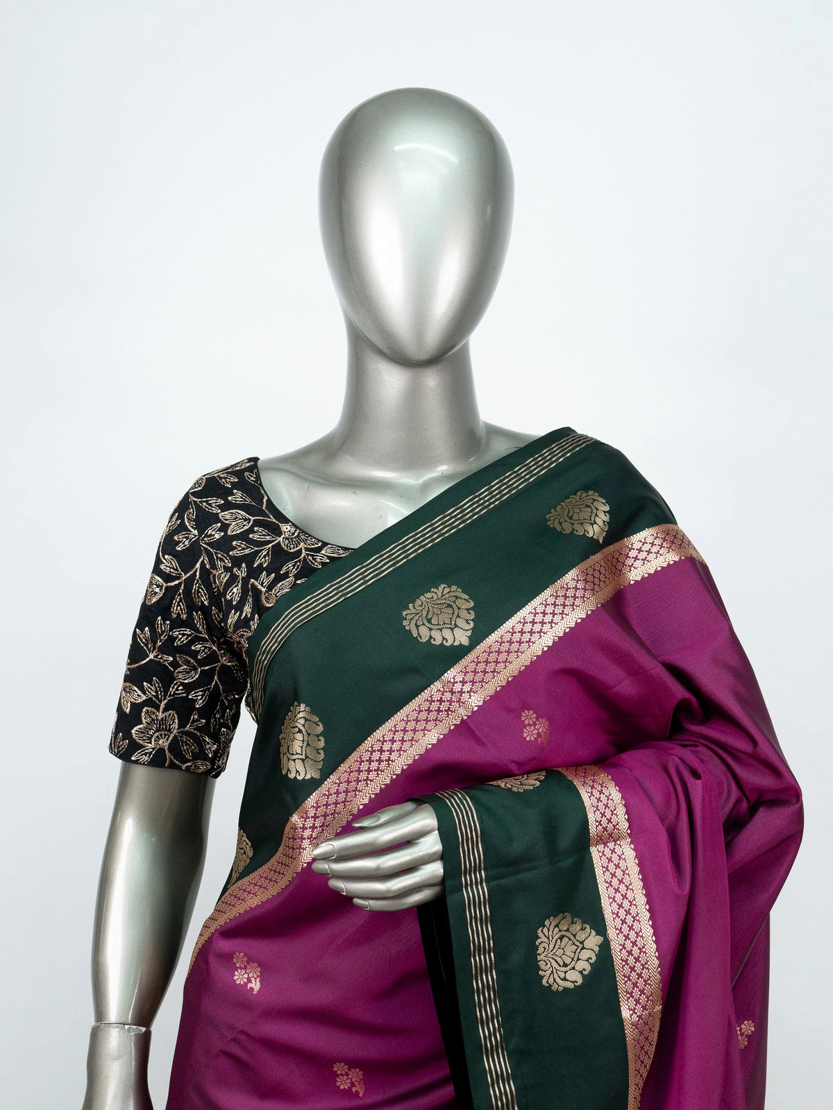 Magenta semi silk saree with dark green gold zari contrast border and floral buttas