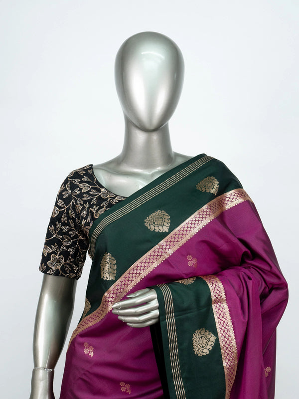 Magenta semi silk saree with dark green gold zari contrast border and floral buttas
