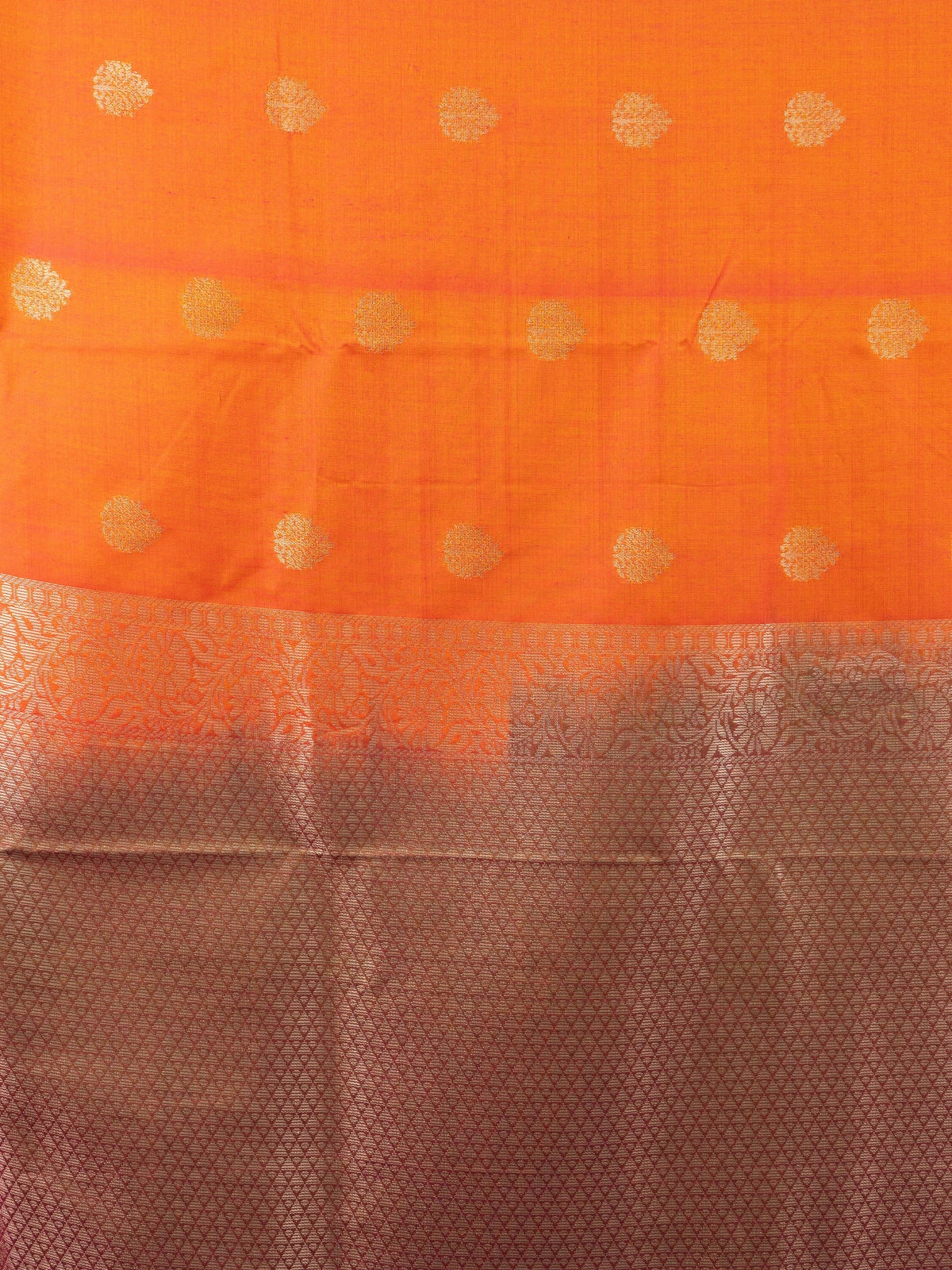 Orange semi silk saree with gold zari buta motifs and contrast copper-gold zari border and pallu