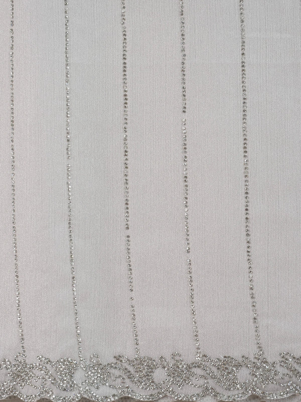 Light grey sheer designer saree with silver stone stripes and scalloped border, styled with a yellow embroidered blouse