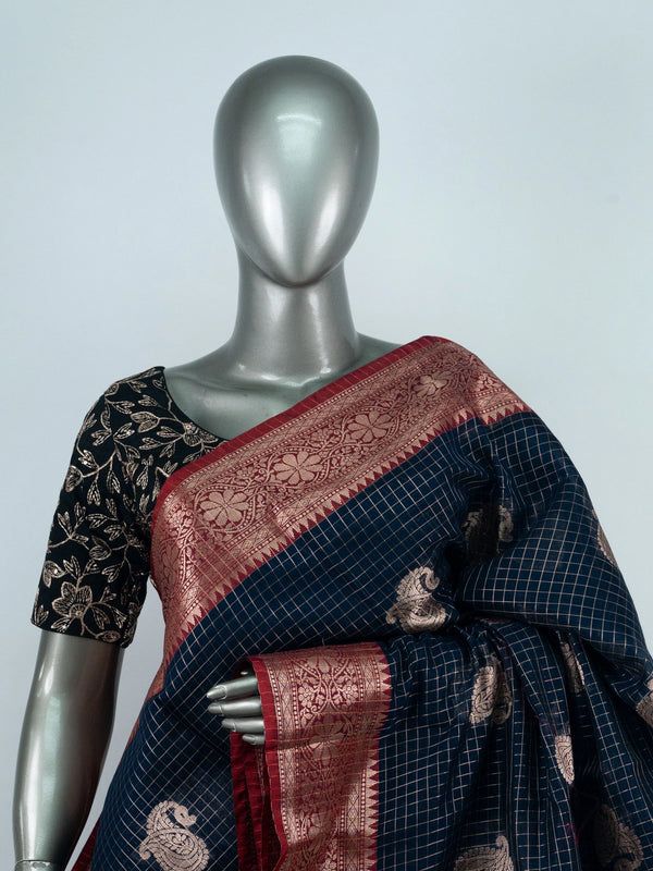 Navy blue semi raw silk saree with zari checks, gold paisley butta and contrast red zari border