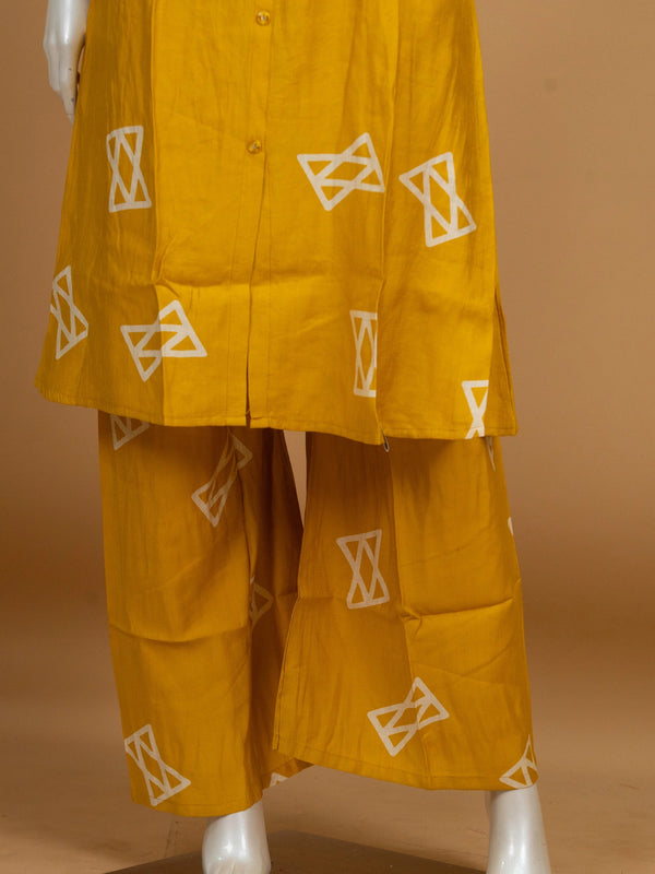 Mustard yellow geometric print cotton sleeveless shirt-style kurti with matching palazzo pants co-ord set