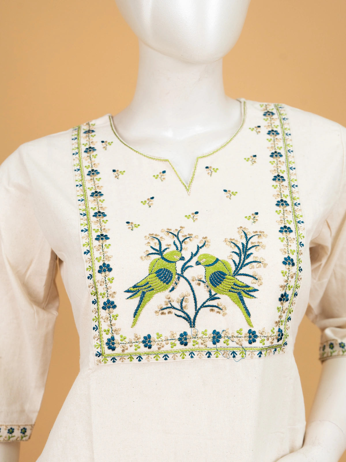 Off-White Cotton Bird Embroidered Anarkali Kurti Top with green and blue parrot motif yoke