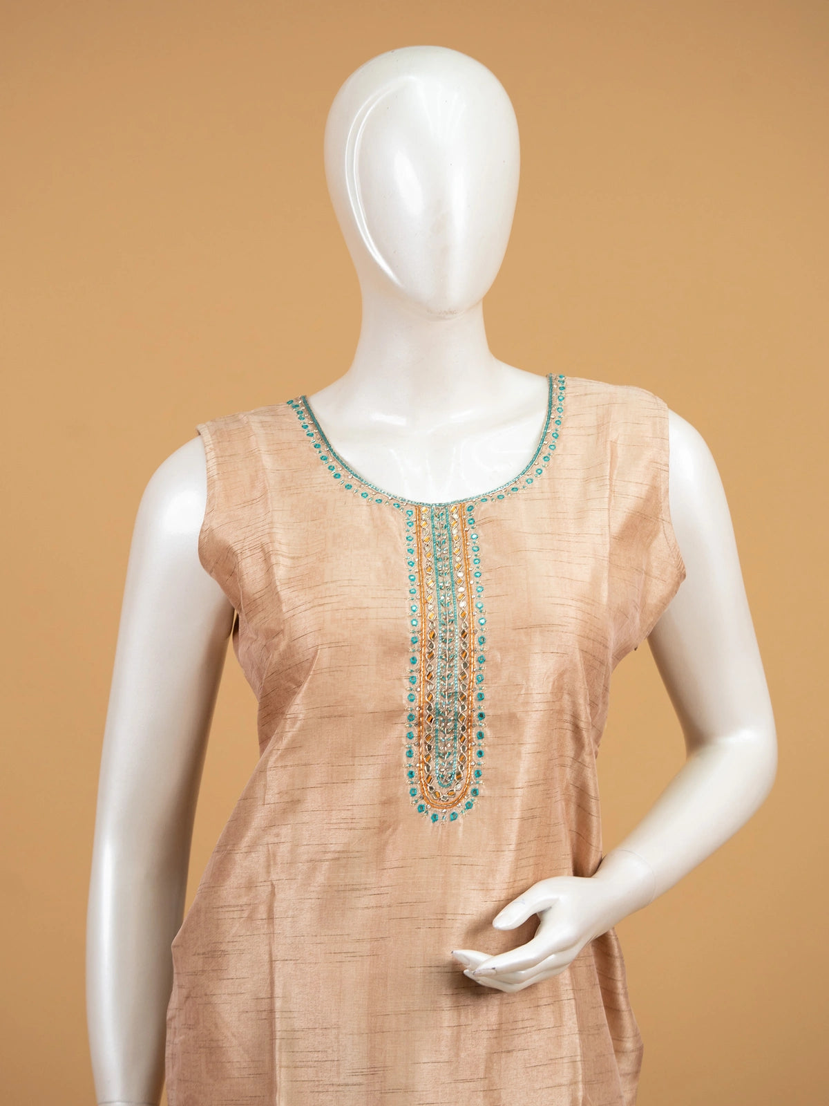 Beige floral raw silk straight cut kurti set with mirror work neckline, teal border and matching dupatta
