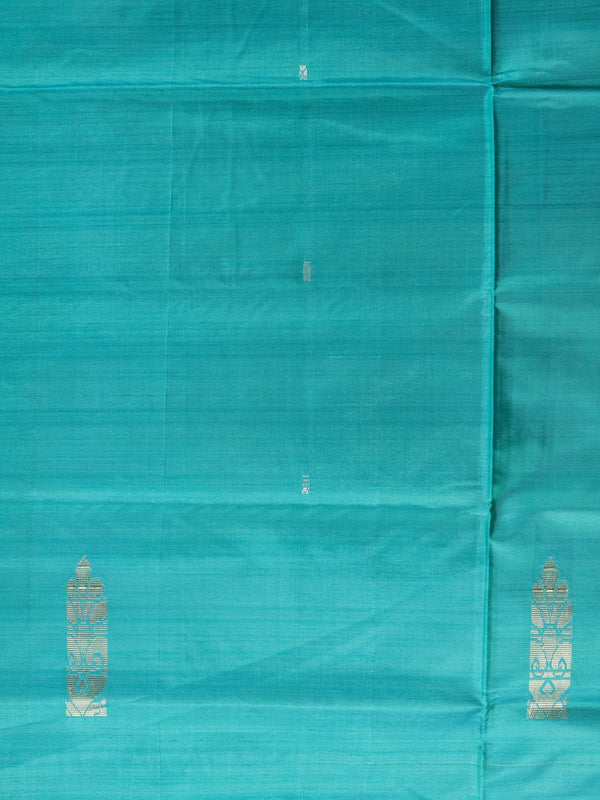 Teal banana silk saree with yellow contrast pallu, silver zari buttas, and matching yellow blouse