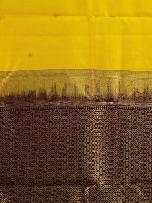 Yellow pure Kanchipuram silk saree with contrast wine border and gold zari brocade pallu