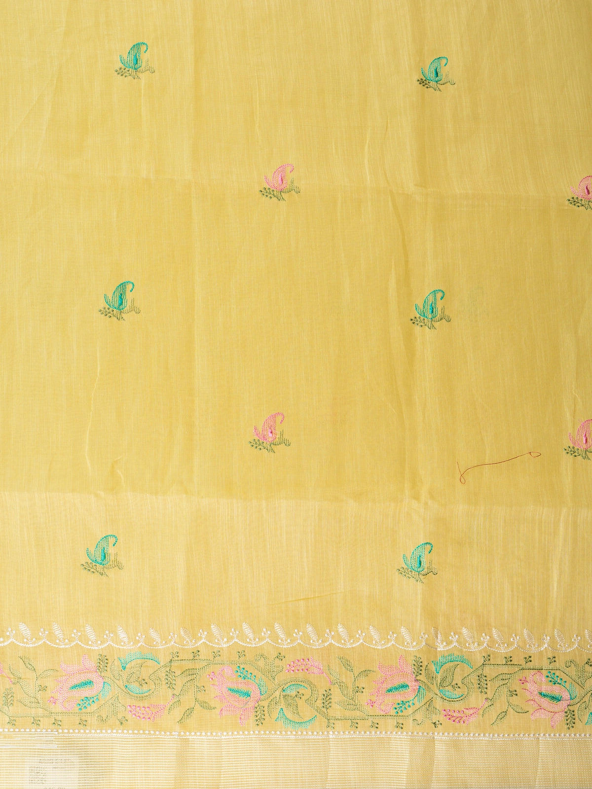 Yellow linen cotton saree with embroidered paisley buti motifs and gold zari border