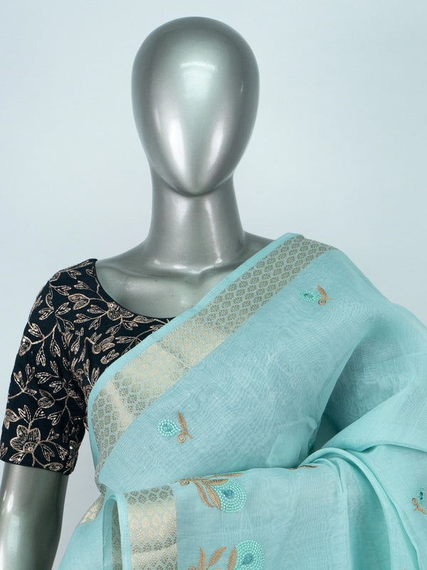 Sky blue linen cotton saree with gold zari border and embroidered floral buttas