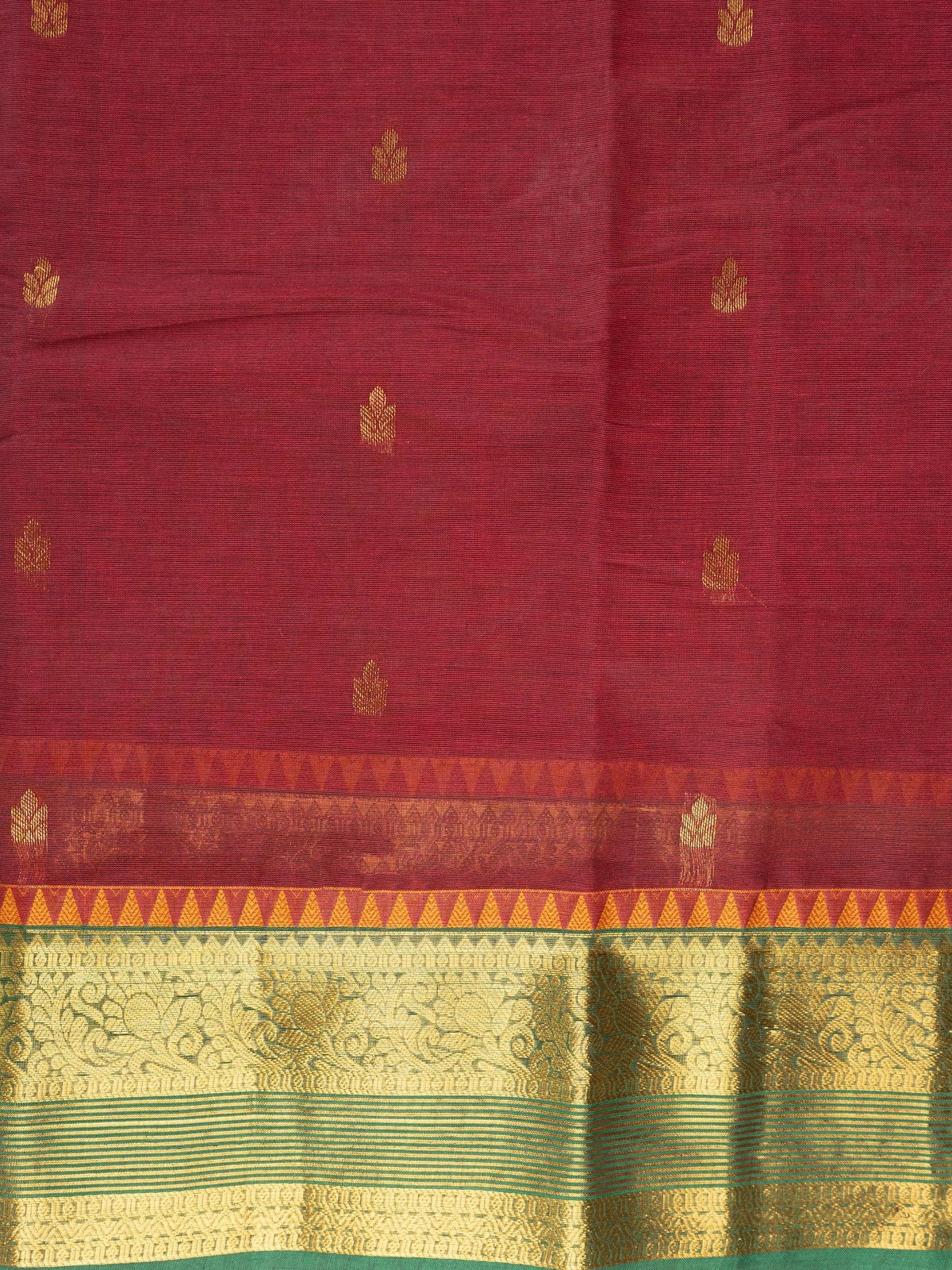 Maroon Chettinad cotton saree with green and gold zari contrast border and gold buttas