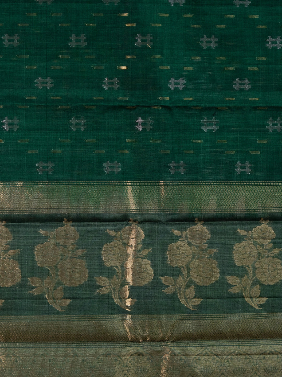 Dark green pure silk cotton saree with gold zari floral border and ikat-style buttas