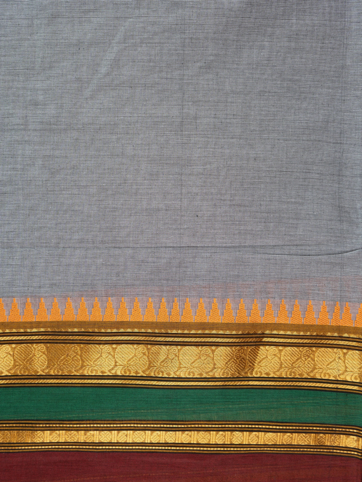 Grey Chettinad cotton saree with contrast mustard, maroon and green border and gold zari temple motifs