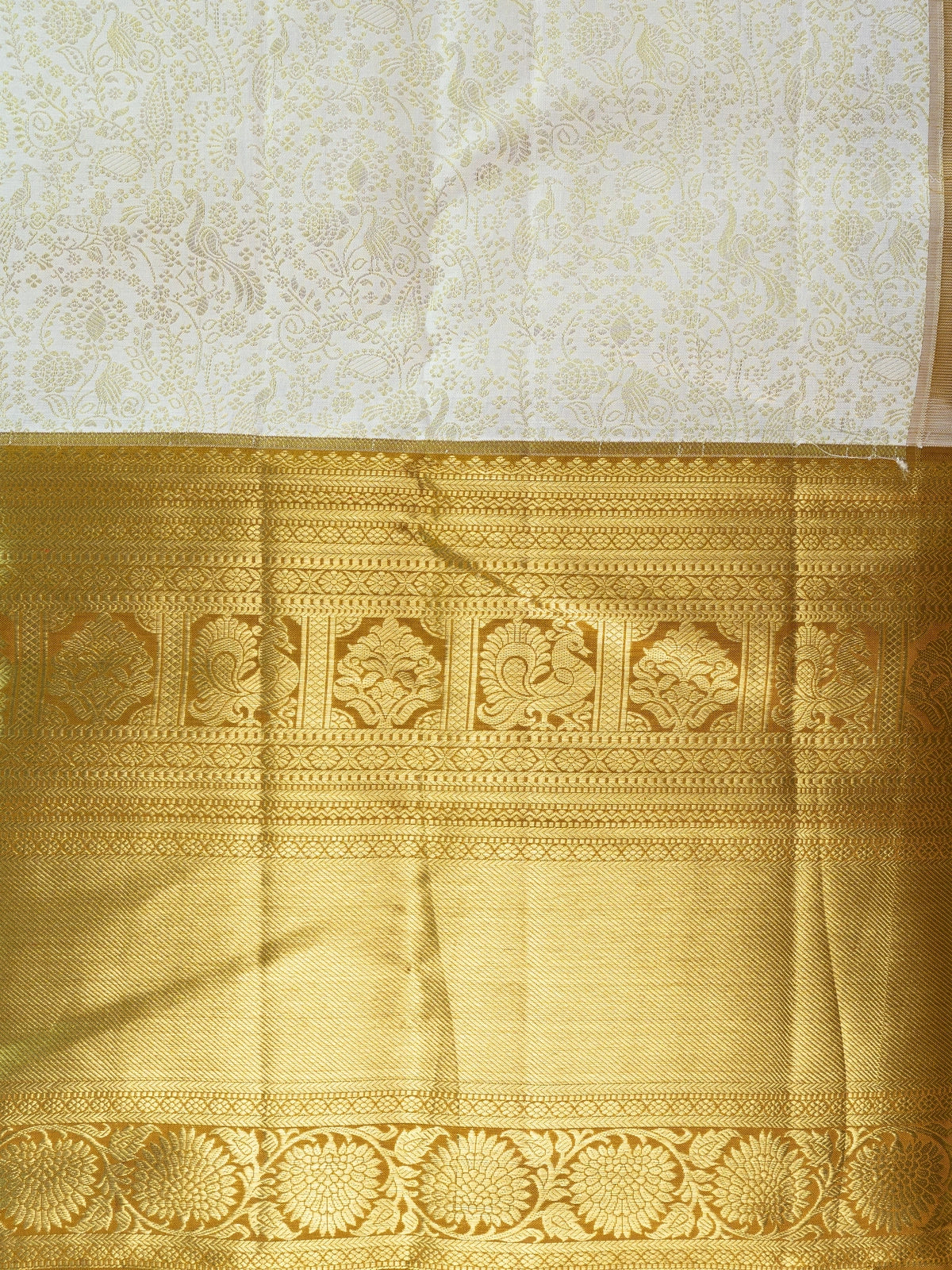Cream pure Kanchipuram silk saree with gold zari floral and peacock border and pallu