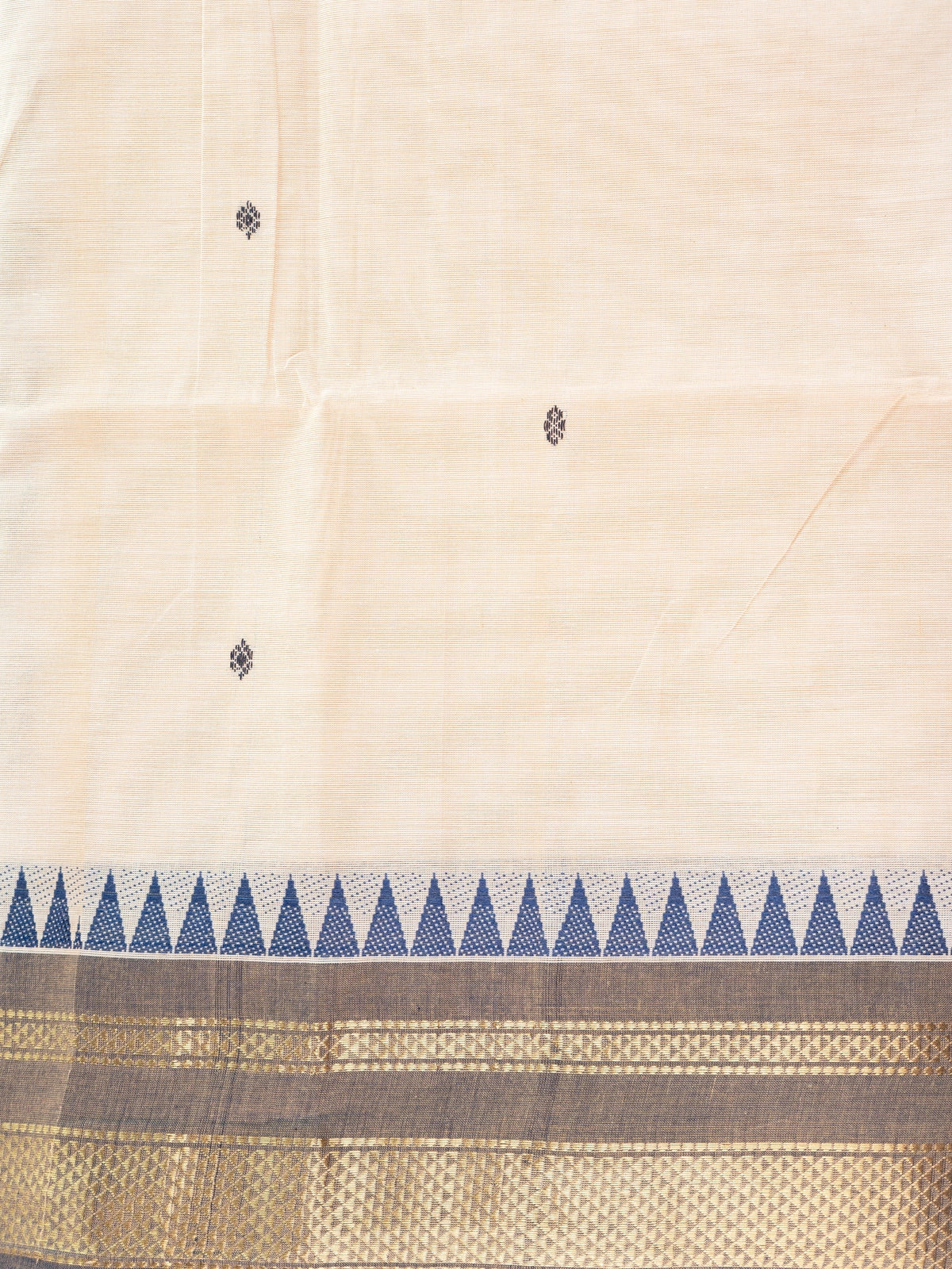 Cream Chettinad cotton saree with navy blue temple border and gold zari