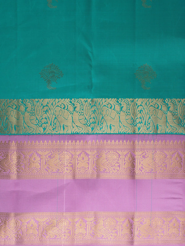 Teal green pure Kanchipuram silk saree with lavender contrast border and gold zari buttas
