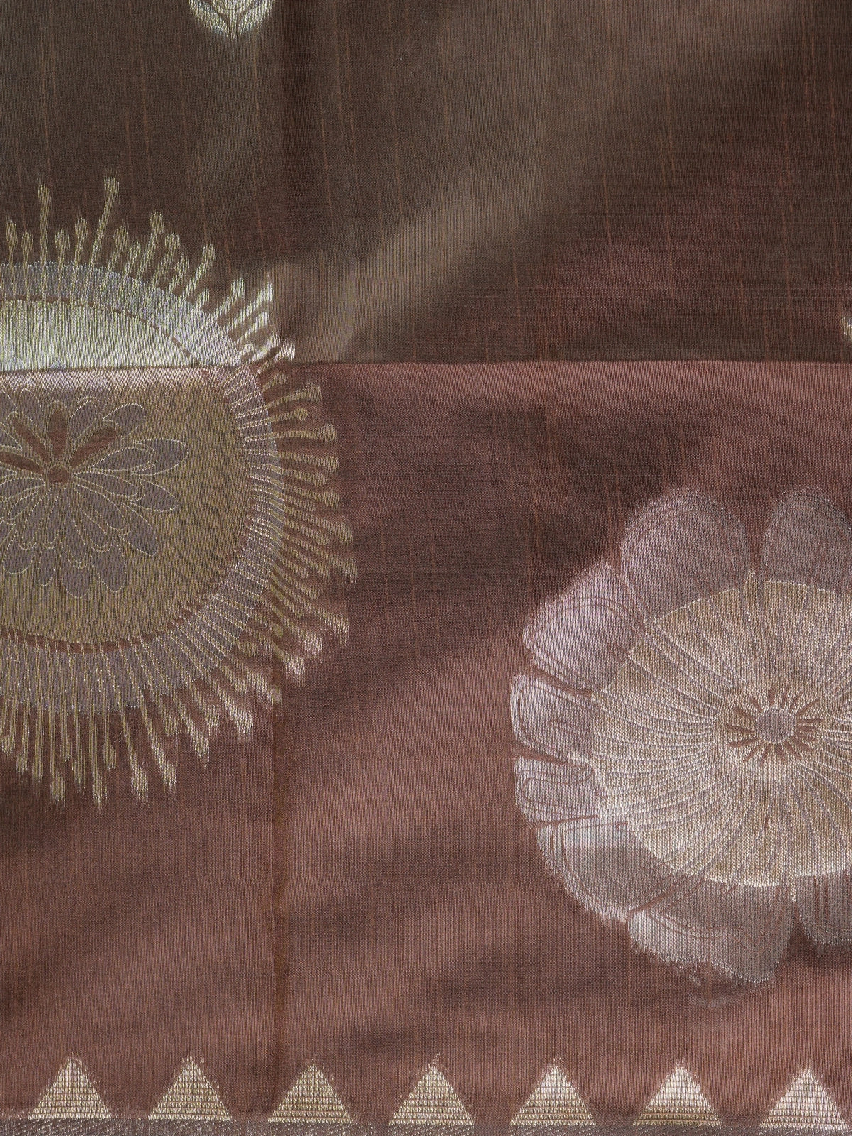 Brown semi tussar saree with gold and silver zari buttas, temple border and floral medallion pallu