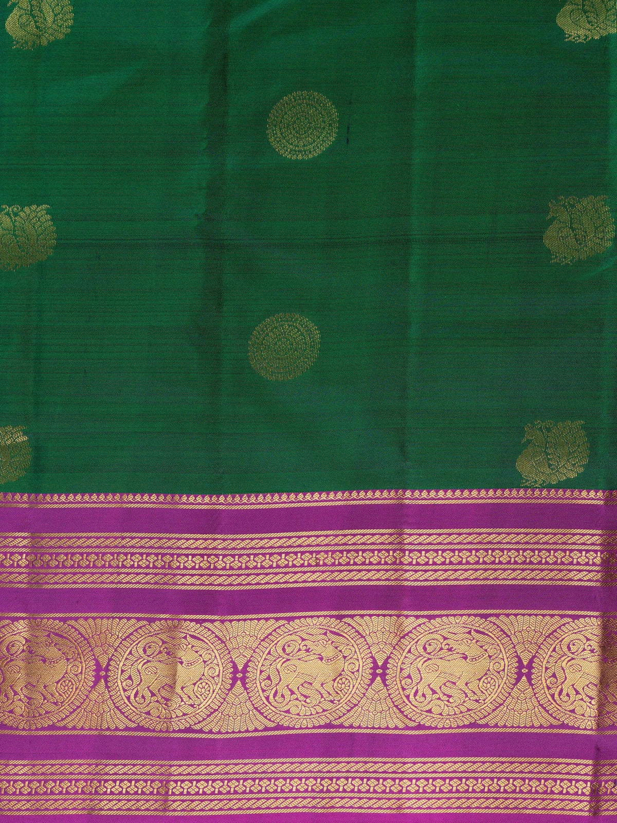 Green pure Kanchipuram silk saree with contrast magenta gold zari border and buttas