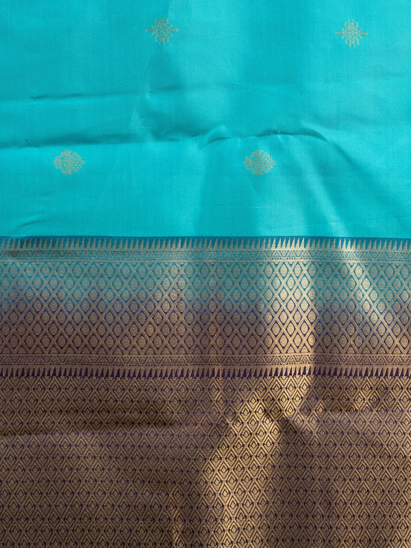 Teal Pure Kanchipuram silk saree with contrast purple and gold zari border and pallu