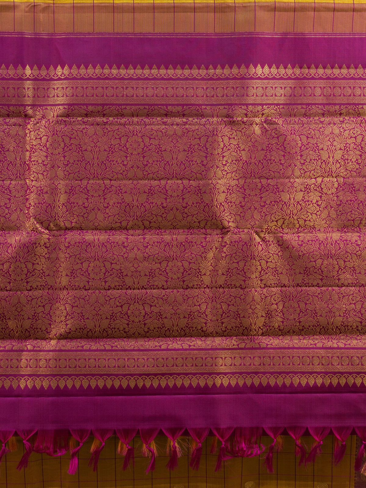 Mustard yellow pure Kanchipuram silk saree with checked body, gold zari buttas and contrast magenta zari border and pallu