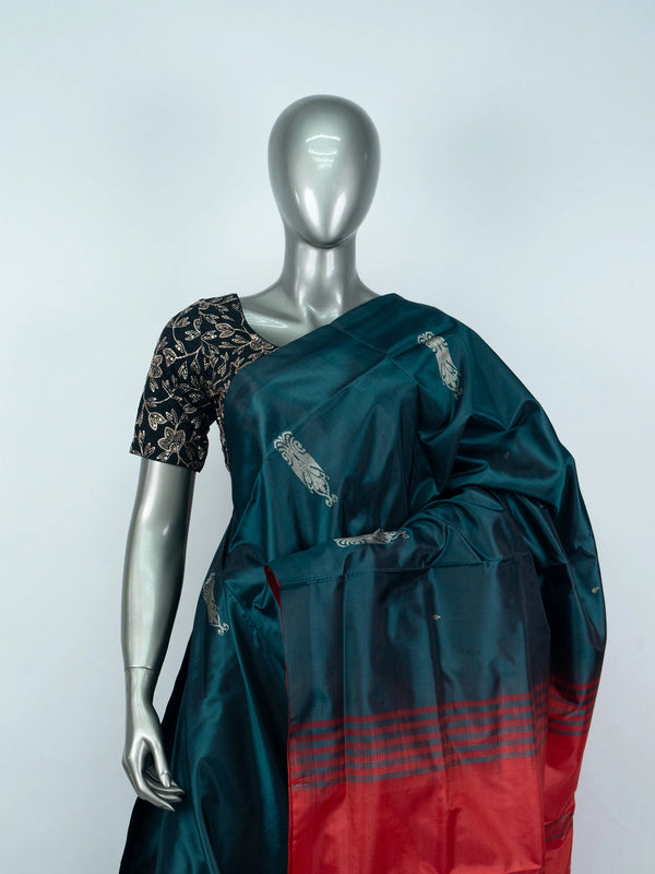 Teal green banana silk saree with gold zari buttas and contrast red striped pallu
