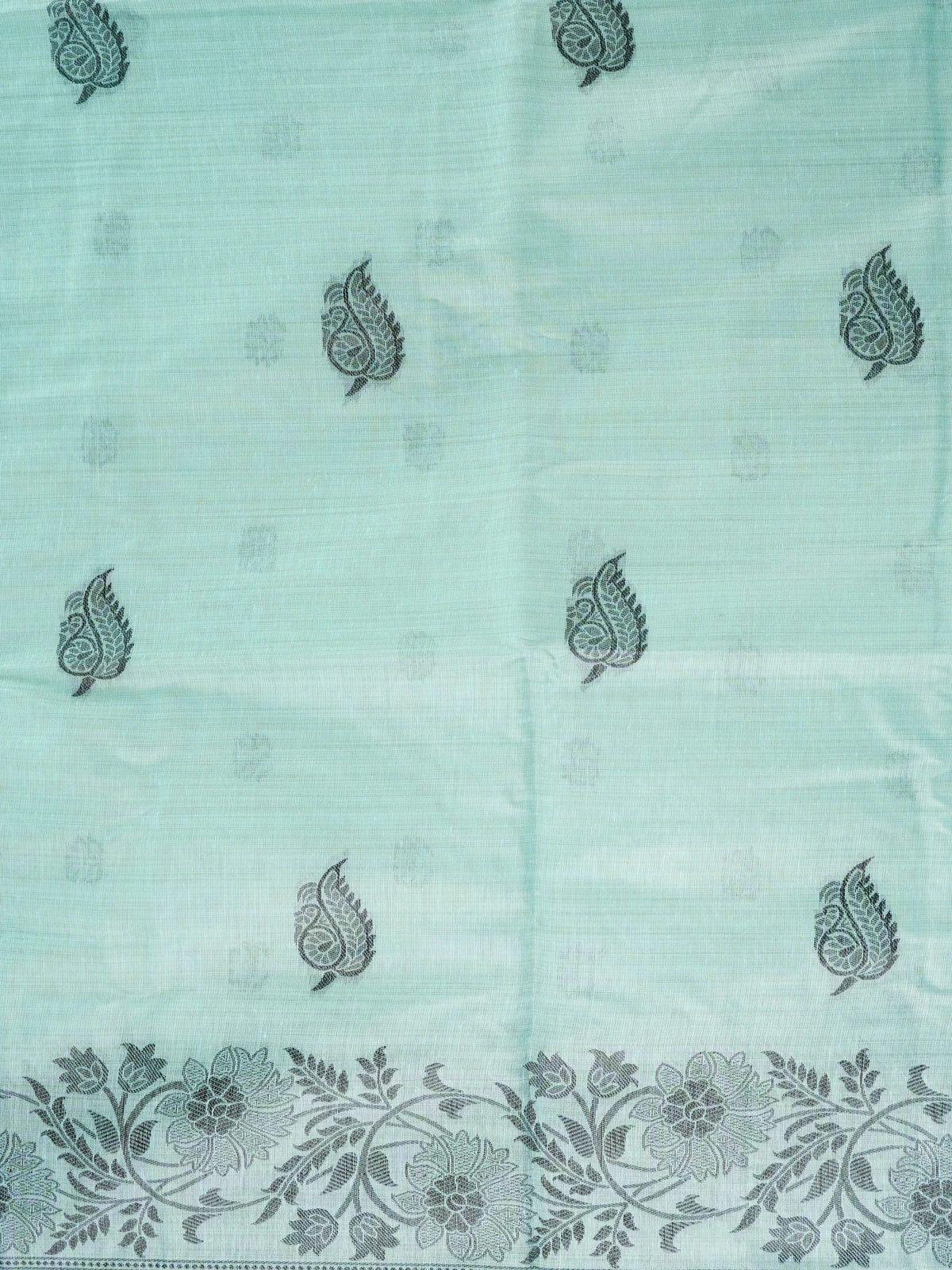 Sea green linen cotton saree with dark teal paisley buttas, floral border and scenic peacock and deer pallu