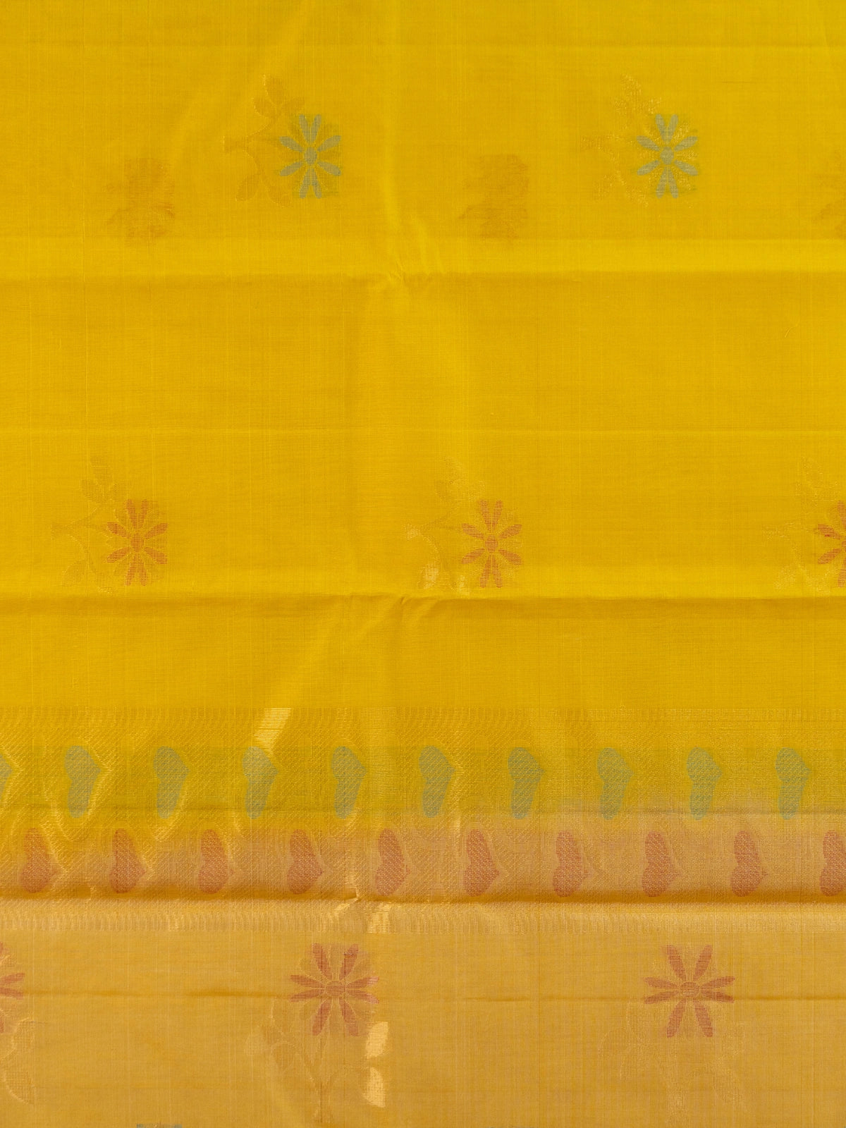 Bright yellow pure silk cotton saree with floral buta motifs and gold zari border