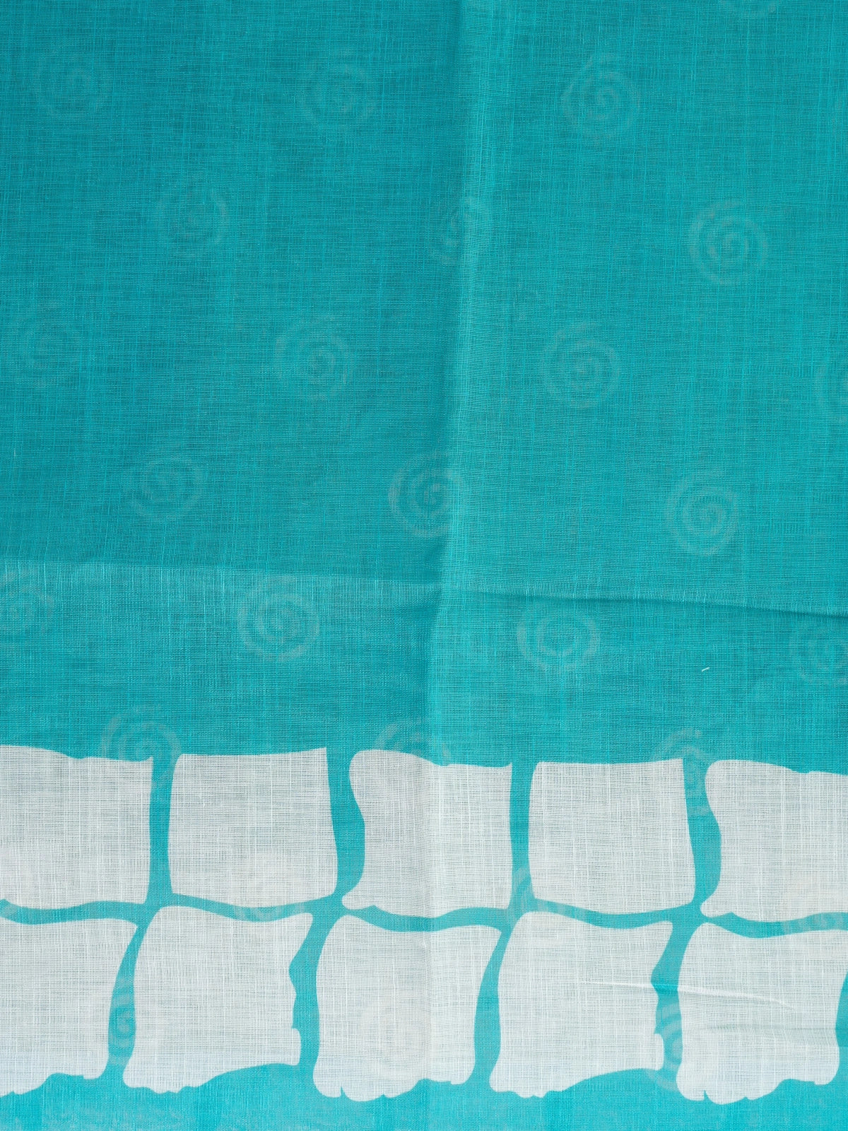Teal and off-white linen cotton saree with batik grid border and white spiral motifs